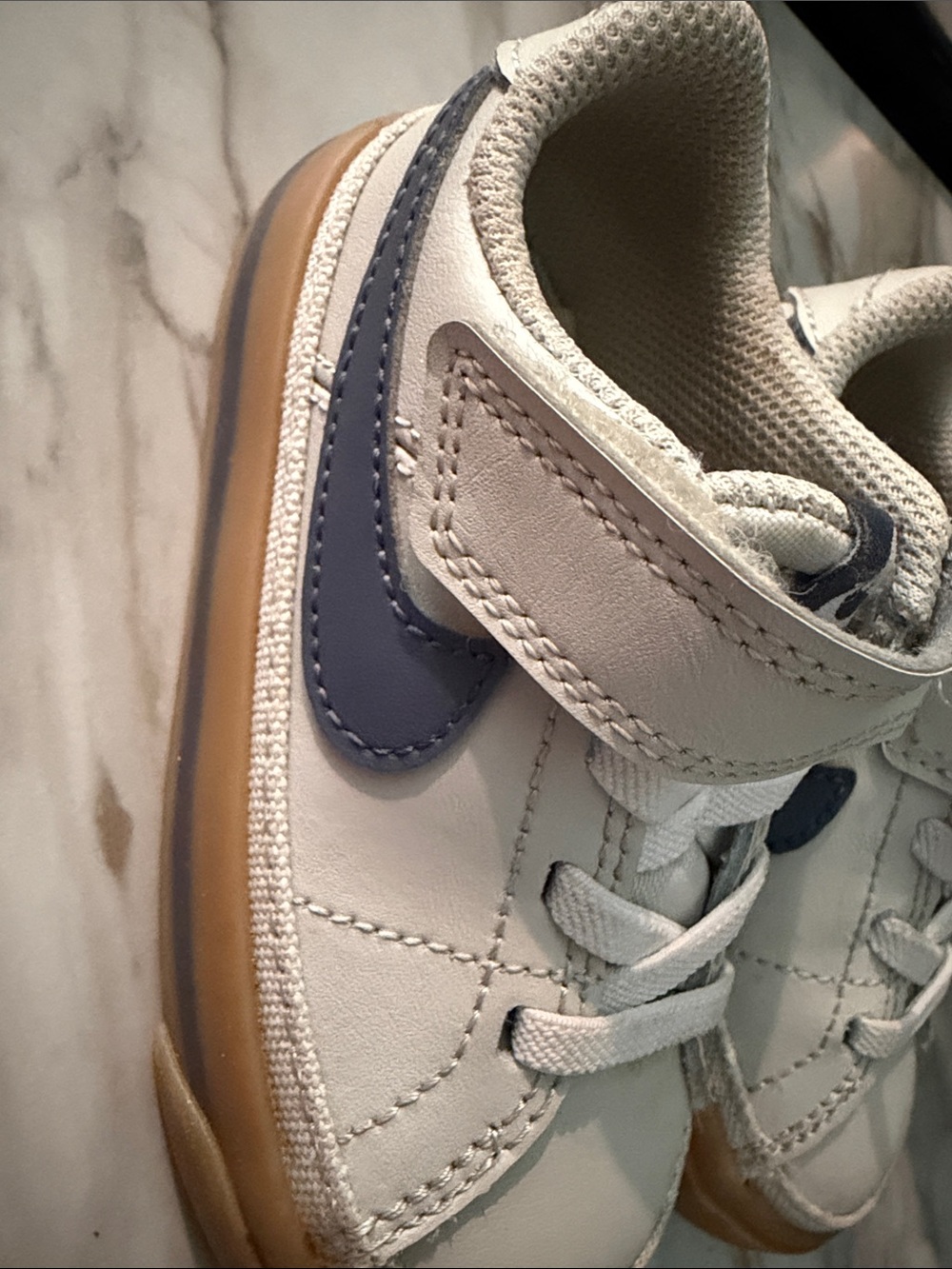 Nike Kids White Sneakers with Navy Swoosh and Gum Sole